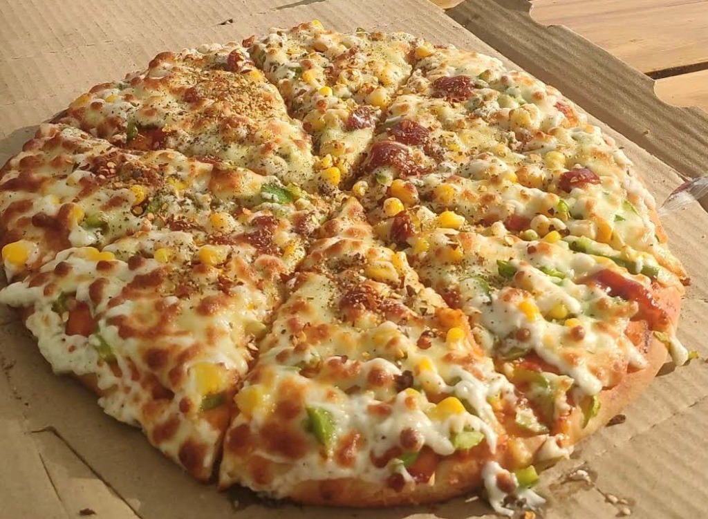 Pure veg cheesy corn pizza GIFT City